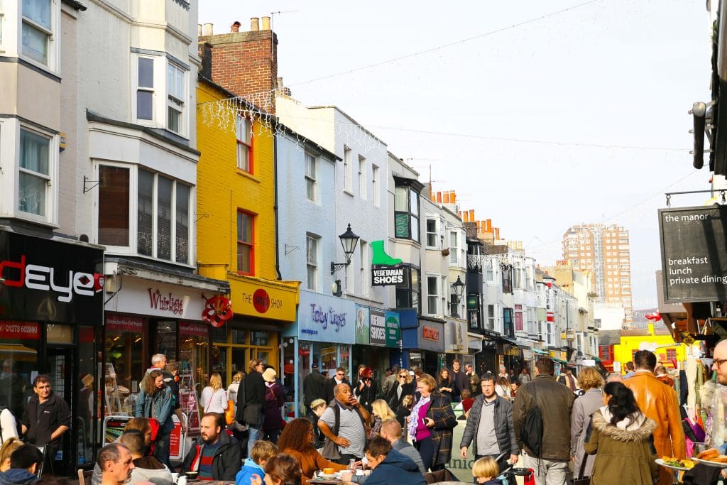 Phot of a crowd outside walking and shopping on North Laine Brighton 